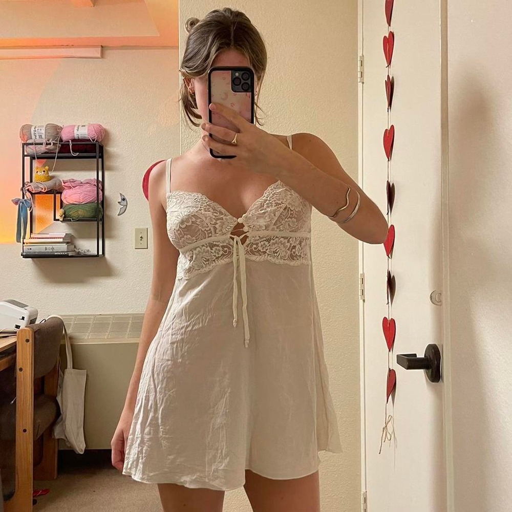 the white sheer lace mini dress with bow and clasp detailing